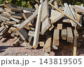 Pile of old construction lumber and wooden beams 143819505