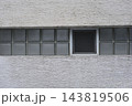 Glass block window window on textured facade wall 143819506