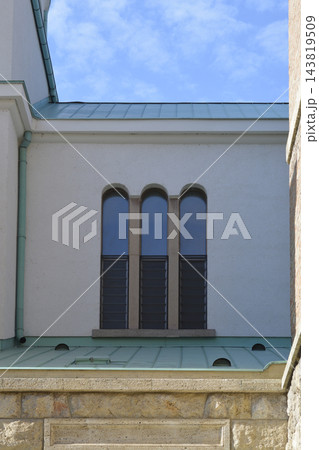 Triple arched window on the upper facade of Saint Blaise Church Triple arched window on the upper facade of Saint Blaise Church 143819509
