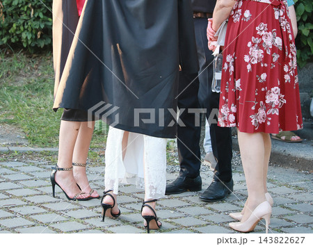 People Showcasing Stylish Footwear And Clothing 143822627