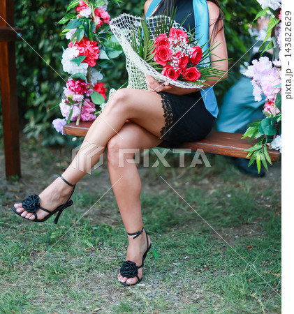 Woman In Black Heels Holding Bouquet 143822629