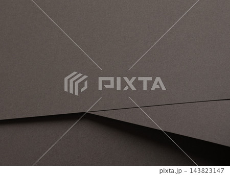 Grey paper texture, overlapping sheets with diagonal fold and crease. Charcoal matte surface close up, folded sheet with fine grain and edge line. Monochrome backdrop, minimalistic designer Grey paper texture, overlapping sheets with diagonal fold and crease. Charcoal matte surface close up, folded sheet with fine grain and edge line. Monochrome backdrop, minimalistic designer 143823147