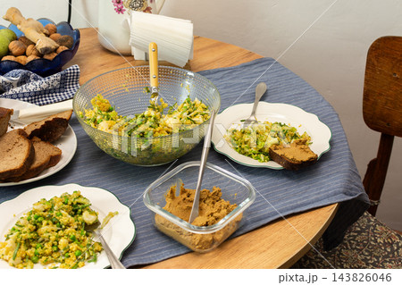 Quinoa with green peas, arugula, cauliflower, and broccoli is served with liver pate at a dining table during breakfast Quinoa with green peas, arugula, cauliflower, and broccoli is served with liver pate at a dining table during breakfast 143826046
