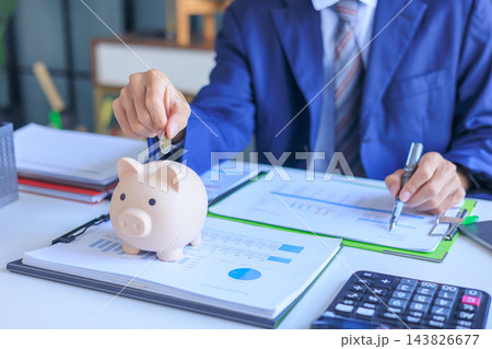 Corporate employee saving money for retirement planning. 143826677