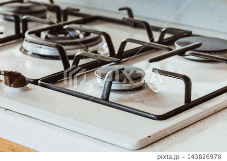 Clean gas kitchen stove on white metal 143826978