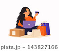Young woman shopping online with laptop, credit card, shopping bags and delivery package. Ecommerce, digital payment and online retail concept. 143827166