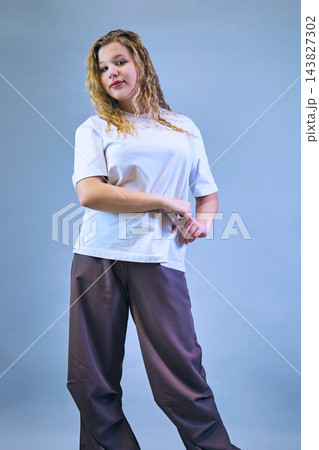 Studio portrait of a girl in casual clothing Studio portrait of a girl in casual clothing 143827302