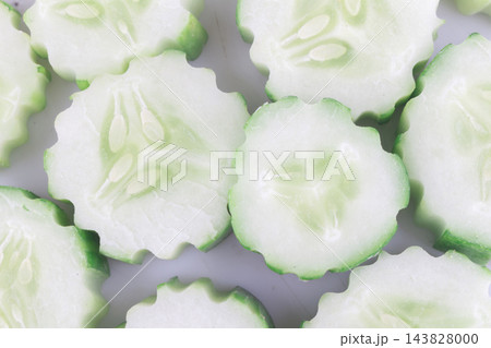 pile sliced cucumber isolated on white background 143828000