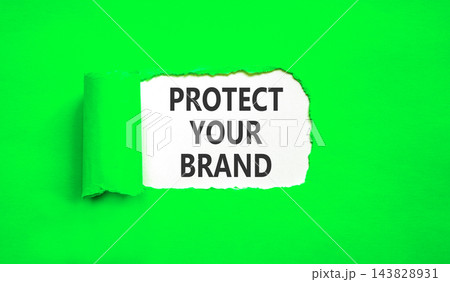 Protect your brand words symbol. Concept words Protect your brand on beautiful white paper. Beautiful green background. Business and protect your brand concept. Copy space. Protect your brand words symbol. Concept words Protect your brand on beautiful white paper. Beautiful green background. Business and protect your brand concept. Copy space. 143828931