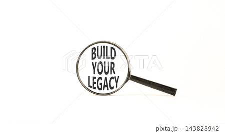 Build your legacy words symbol. Concept words Build your legacy in beautiful magnifying glass. Beautiful white background. Business build your legacy concept. Copy space. Build your legacy words symbol. Concept words Build your legacy in beautiful magnifying glass. Beautiful white background. Business build your legacy concept. Copy space. 143828942