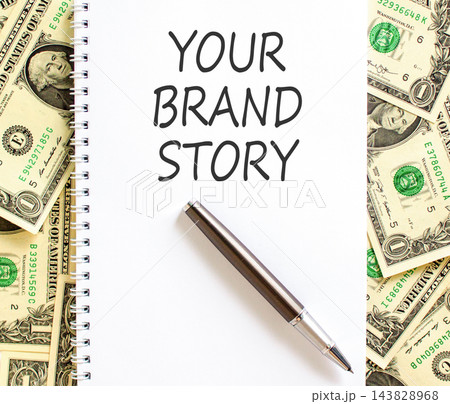 Branding and your brand story symbol. Concept words Your brand story on beautiful white note. Beautiful dollar bills background. Business branding your brand story concept. Copy space. 143828968