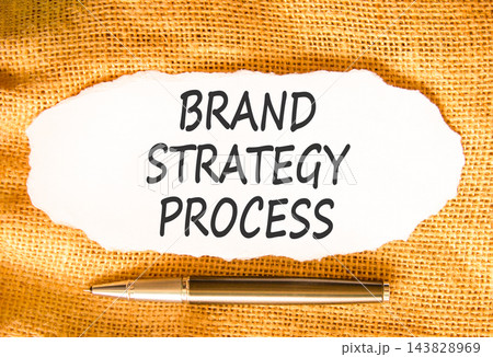 Brand strategy process words symbol. Concept words Brand strategy process on beautiful white paper. Beautiful canvas background. Black pen. Business and brand strategy process concept. Copy space. Brand strategy process words symbol. Concept words Brand strategy process on beautiful white paper. Beautiful canvas background. Black pen. Business and brand strategy process concept. Copy space. 143828969