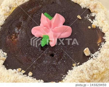 Chocolate Cake with Pink Cream Flower Decoration Chocolate Cake with Pink Cream Flower Decoration 143829450