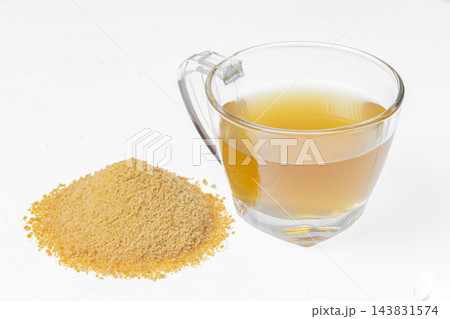 Drink of piloncillo and ground piloncillo, on white background Drink of piloncillo and ground piloncillo, on white background 143831574