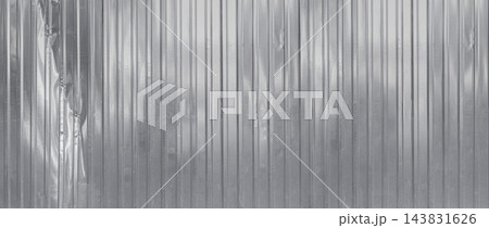 Corrugated metal sheet surface showing textured pattern 143831626