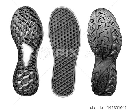 Three shoe soles with contrasting rubber tread patterns Three shoe soles with contrasting rubber tread patterns 143831641