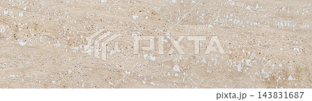 Beige travertine stone surface showing natural textured background Beige travertine stone surface showing natural textured background 143831687