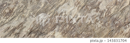 Layered stone surface with rugged geological texture 143831704