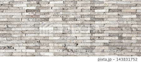 Travertine stone wall surface showing natural texture Travertine stone wall surface showing natural texture 143831752