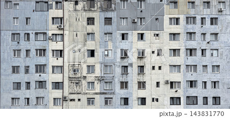 Urban apartment building facade with many windows Urban apartment building facade with many windows 143831770