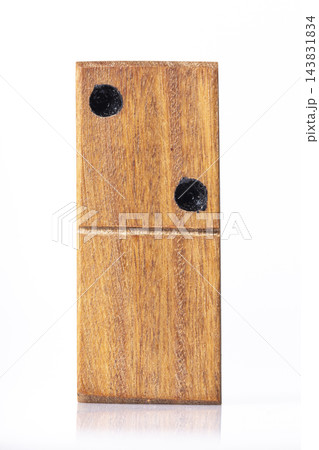 Domino tiles, handcrafted in wood, on white background, close-up Domino tiles, handcrafted in wood, on white background, close-up 143831834