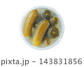 Fermented food. Pickled cucumbers in a plastic container, isolated on a white background. Preserved vegetables and healthy eating. Top view. 143831856