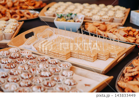 Assorted pastries and desserts served at a buffet Assorted pastries and desserts served at a buffet 143833449