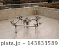 Stainless steel fountain nozzles and plumbing system in an urban public square 143833589