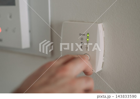 Turning on the heating in a European apartment at the start of the heating season Turning on the heating in a European apartment at the start of the heating season 143833590
