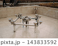 Stainless steel fountain nozzles and plumbing system in an urban public square 143833592