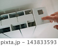 Turning on radiator heating at home with an electronic temperature controller 143833593