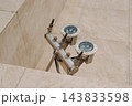 Stainless steel fountain nozzles and plumbing system in an urban public square 143833598