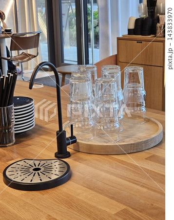 Glass coffee brewing equipment and decorative scale on wooden counter 143833970