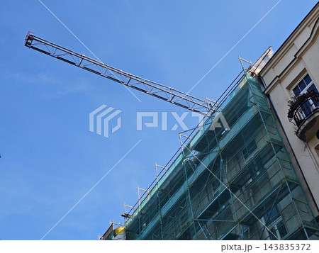 Warsaw, Poland - October 7, 2026: Construction Crane Above Scaffolded Historic Building 143835372