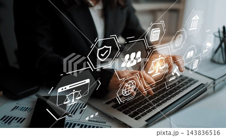 Professional Businesswoman Using Laptop with Digital Icons Illustrating Legal Concepts, Privacy Protection, and Team Collaboration in Modern Office Setting Gluon 143836516