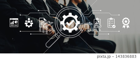 Business Professionals Engaged in Team Meeting with Focus on Technology and Data Analysis for Process Improvement and Strategic Planning. Nascent 143836883