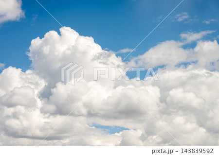 White Cumulus Clouds in a Blue Sky over Kangding Shi, Sichuan 143839592
