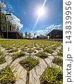 A sidewalk in the park 143839956