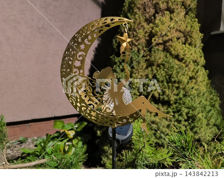 Solar-powered garden light featuring a fairy and a moon 143842213