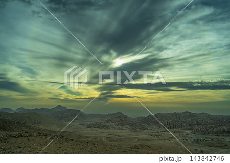 Dramatic sunset sky over the desert landscape of Shoubak in Jordan Dramatic sunset sky over the desert landscape of Shoubak in Jordan 143842746