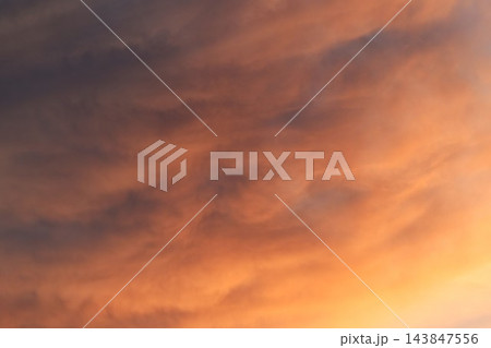 cloud spreading on orange twight sky in evening cloud spreading on orange twight sky in evening 143847556