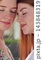 Vertical video. Two lesbian woman lgbt couple hugging, kissing. Concept of LGBT happiness, freedom, love couple. 143848319