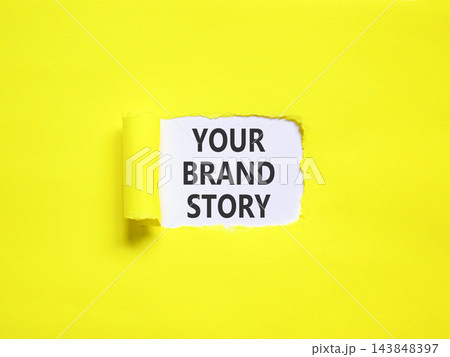 Branding and your brand story symbol. Concept words Your brand story on beautiful white paper. Beautiful yellow paper background. Business branding your brand story concept. Copy space. Branding and your brand story symbol. Concept words Your brand story on beautiful white paper. Beautiful yellow paper background. Business branding your brand story concept. Copy space. 143848397