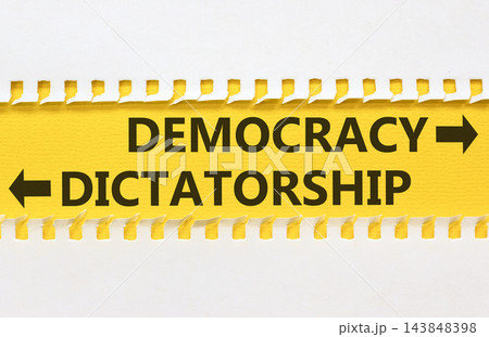 Democracy or dictatorship words symbol. Concept words Democracy Dictatorship on beautiful yellow paper. Beautiful white background. Business democracy dictatorship concept. Copy space Democracy or dictatorship words symbol. Concept words Democracy Dictatorship on beautiful yellow paper. Beautiful white background. Business democracy dictatorship concept. Copy space 143848398