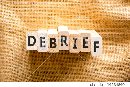 Debrief word symbol. Concept word Debrief on beautiful wooden blocks. Beautiful canvas background. Business debrief word concept. Copy space. Debrief word symbol. Concept word Debrief on beautiful wooden blocks. Beautiful canvas background. Business debrief word concept. Copy space. 143848404