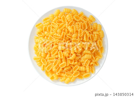 Pasta gnocchi on ceramic plate isolated on white background. Various of uncooked pasta. Served with minced meat, thick vegetable sauces, or cheese sauces. Top view. Pasta gnocchi on ceramic plate isolated on white background. Various of uncooked pasta. Served with minced meat, thick vegetable sauces, or cheese sauces. Top view. 143850314
