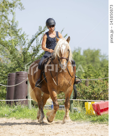 riding girl and horse 143850873