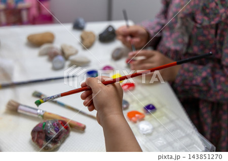 Children Painting Stones With Colorful Paints During Creative Craft Activity. 143851270
