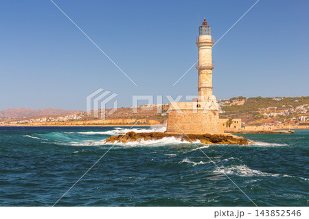 Historic Venetian Lighthouse Surrounded by Sea Waves in Chania Crete Greece Historic Venetian Lighthouse Surrounded by Sea Waves in Chania Crete Greece 143852546