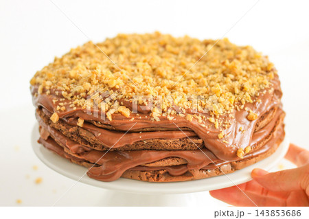 Homemade chocolate cake with nuts served on a plate close up 143853686